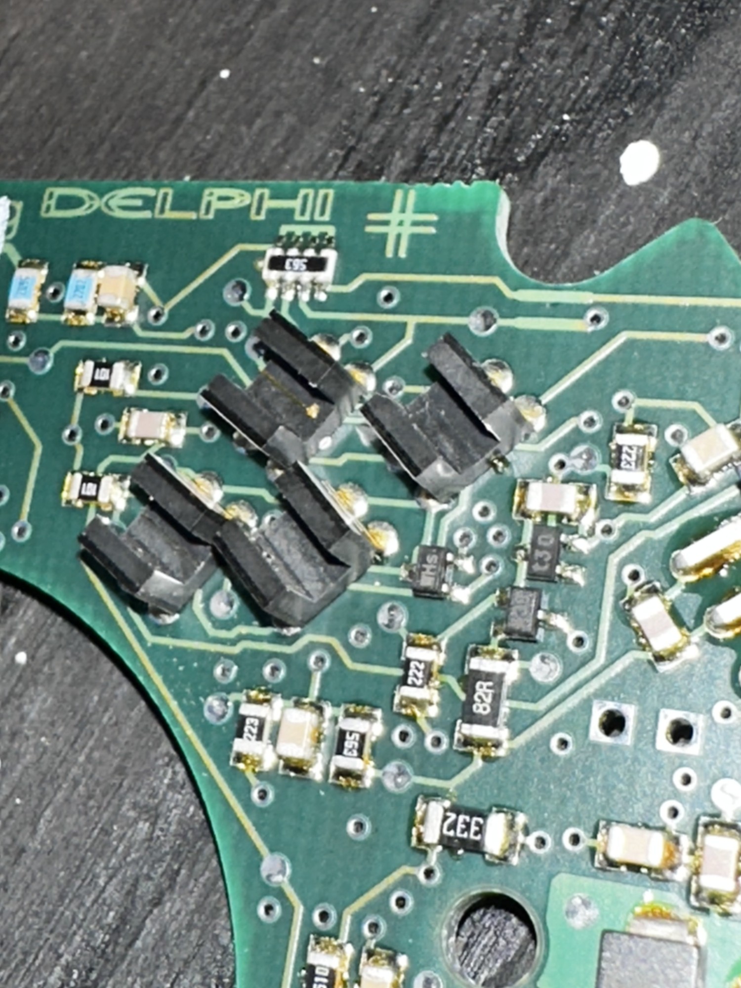 Close-up of the selector optical-sensor slots inspected during the limp-mode repair