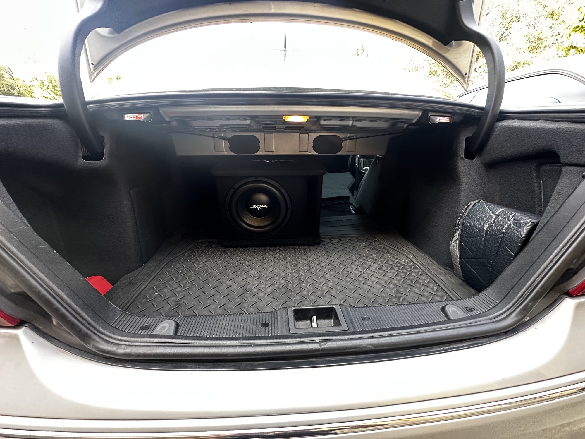 C32 AMG installed subwoofer enclosure with trunk trim restored