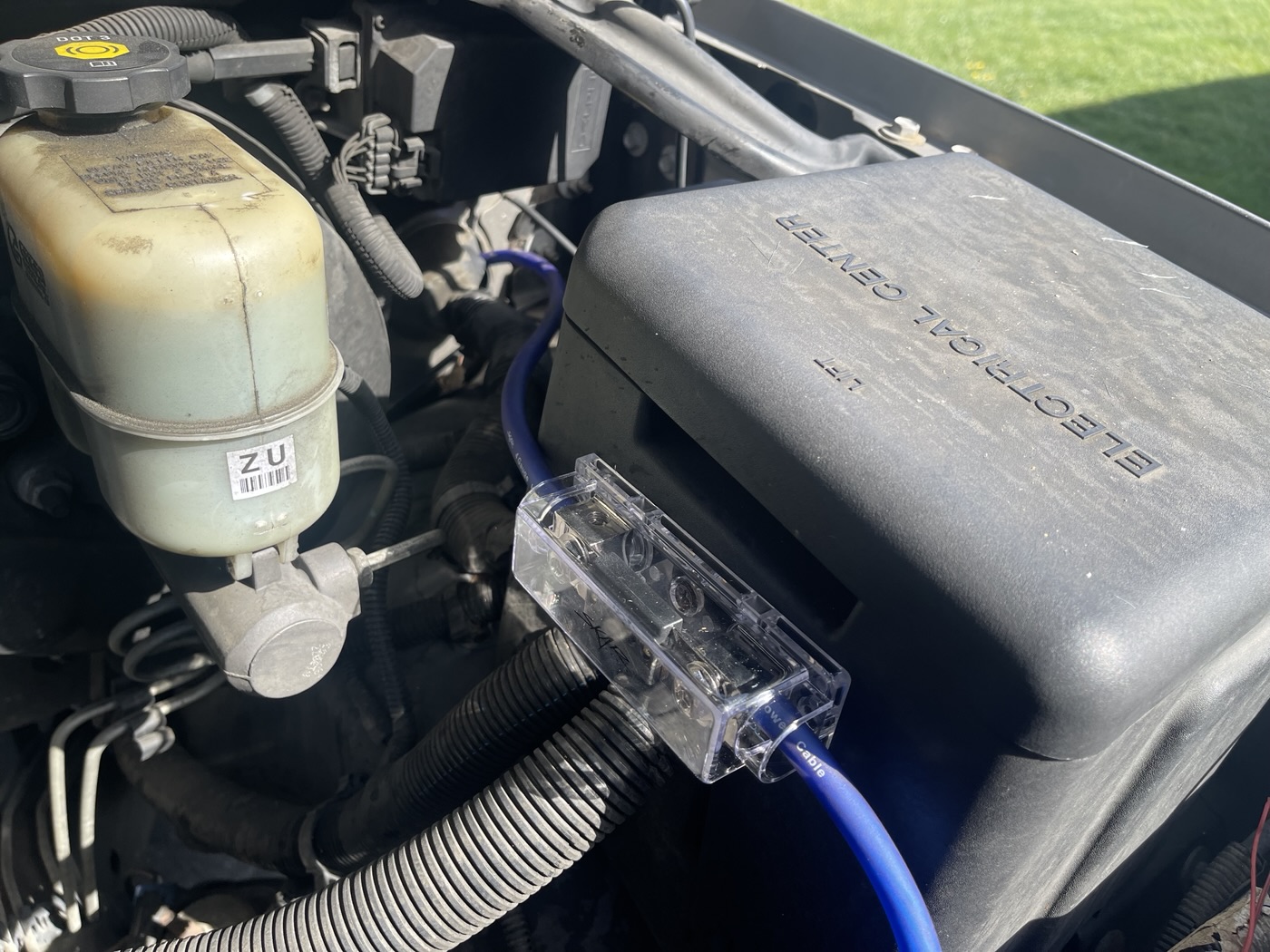 Customer SUV, April 2022: fused audio supply beside the underhood electrical enclosure